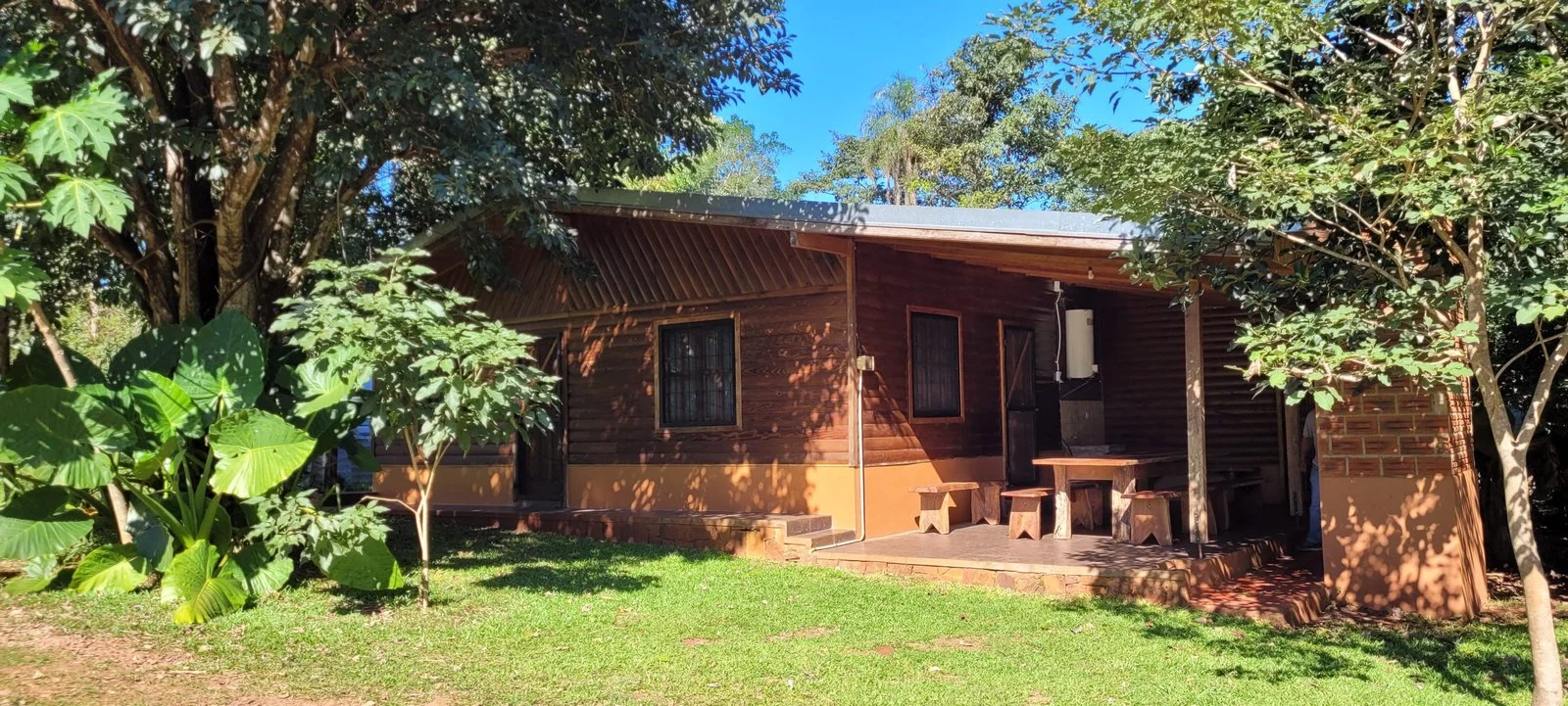 Cabin for 8 people with its own covered BBQ area at Camping Tierra Roja, Puerto Iguazú