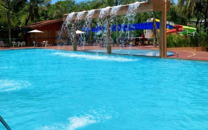Main pool with a water curtain and pergola at the Tierra Roja Water Park in Puerto Iguazú